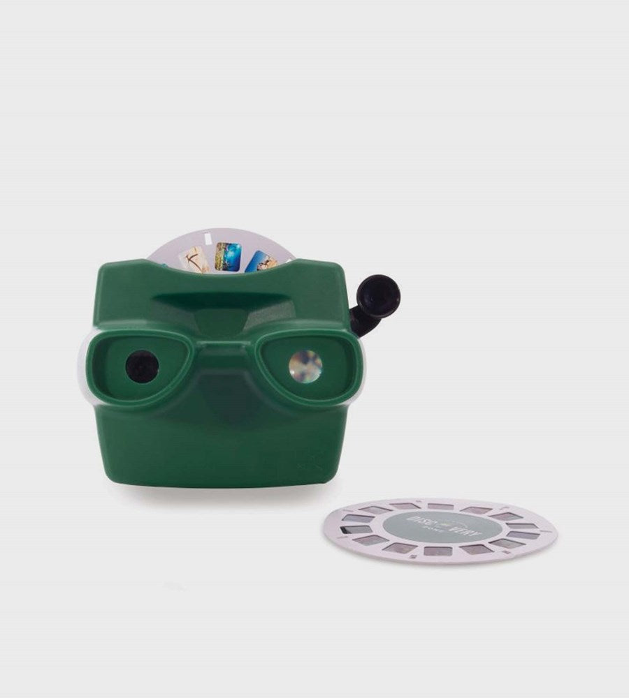 Green vintage-style viewer with a roll of film on a white background