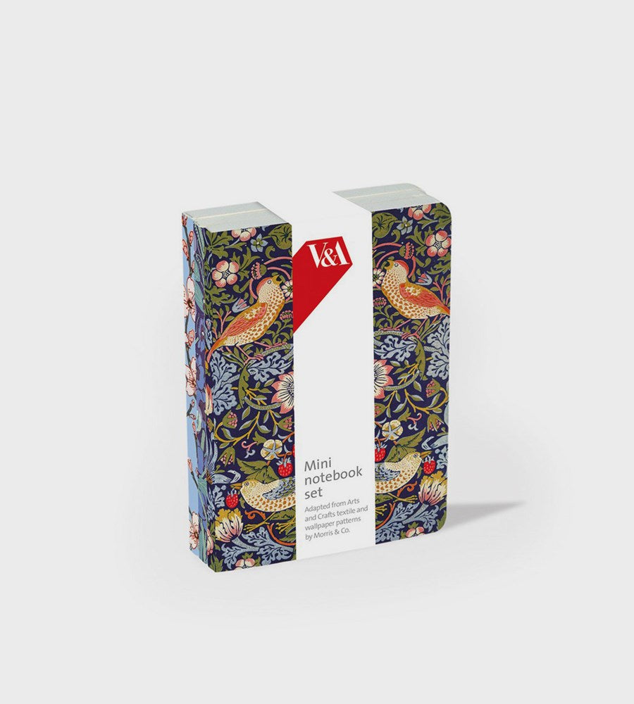 Two mini notebooks with decorative covers and a visible brand logo on a white background