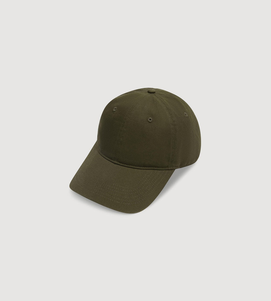 Green baseball cap on a light gray background