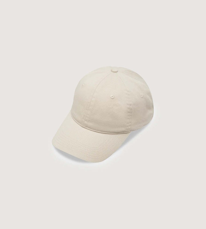Beige baseball cap on a light gray background