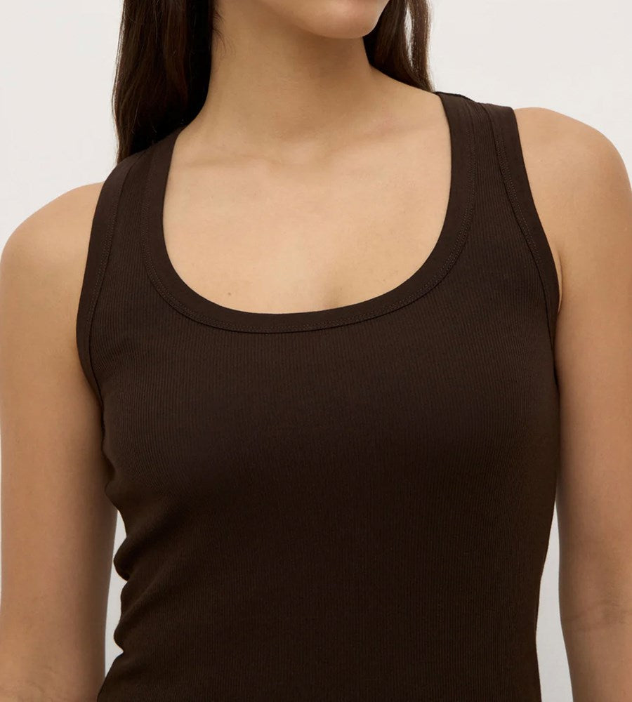 Brown tank top worn by a person on a plain background