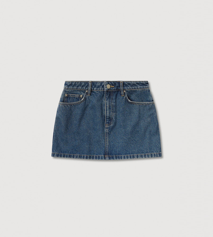 Blue denim skirt on a light gray background