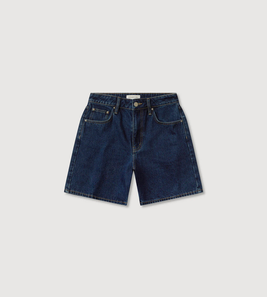 Blue denim shorts on a light gray background
