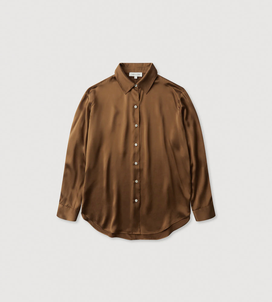 Brown shirt on a light gray background