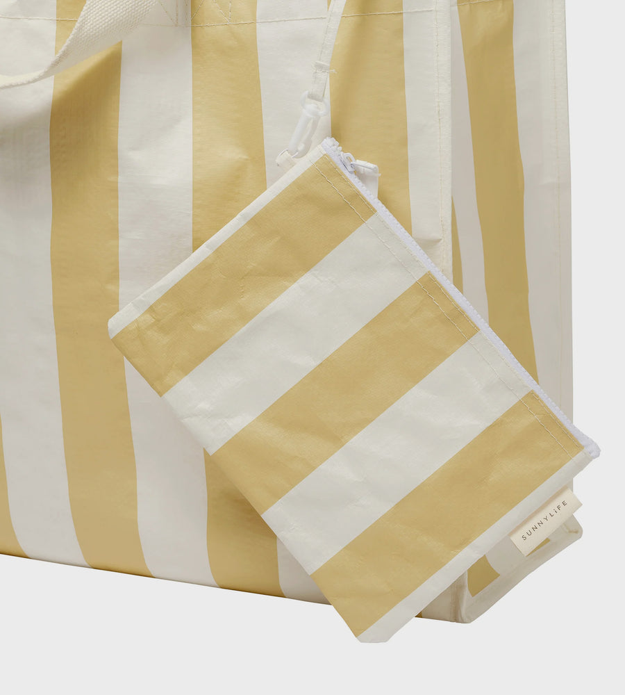 Yellow and white striped fabric with a folded piece on a light gray background