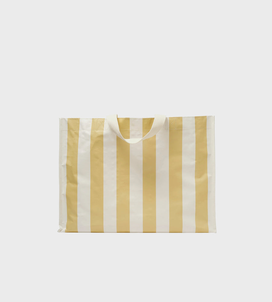 Rectangular bag with yellow and white vertical stripes on a light gray background