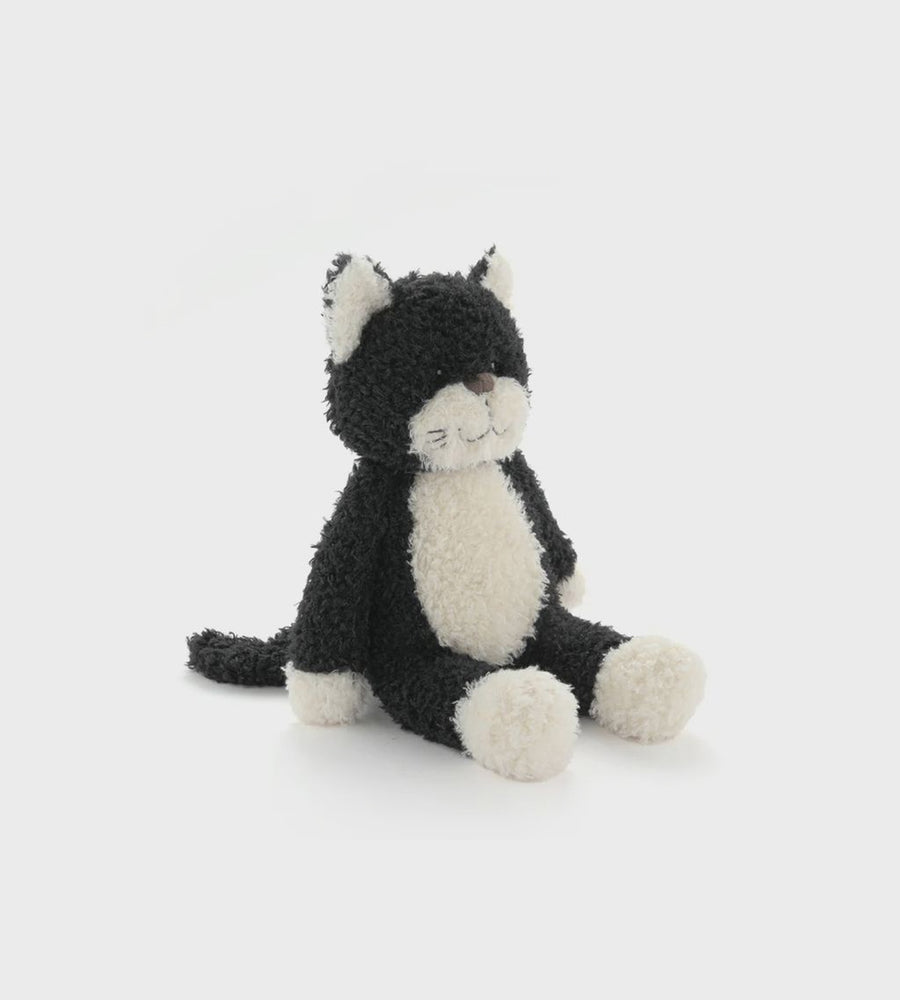 Black and white plush cat toy on a white background