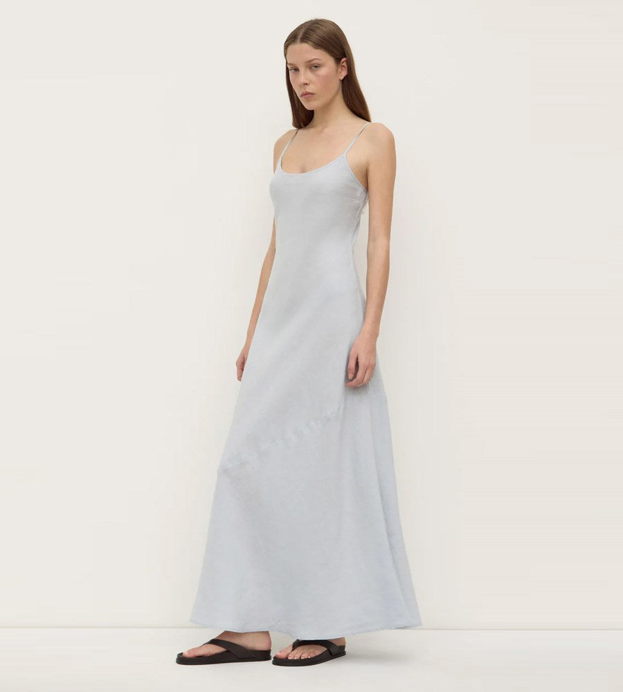 Woman wearing a light blue dress on a white background