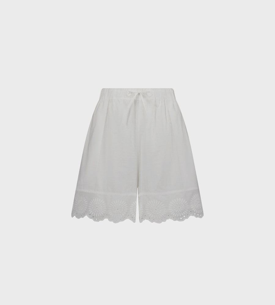 White lace-trimmed skirt on a light gray background