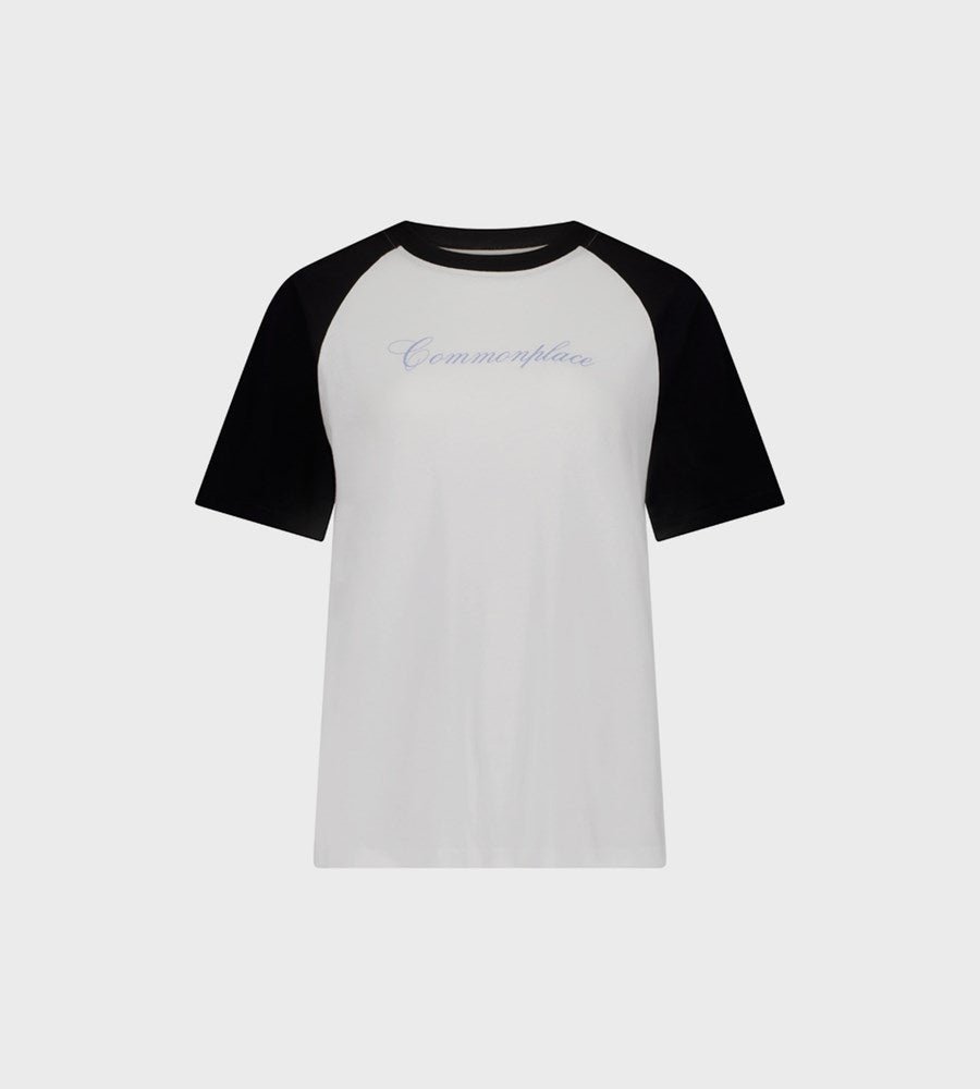 White and black baseball shirt with 'Commonplace' branding on a white background