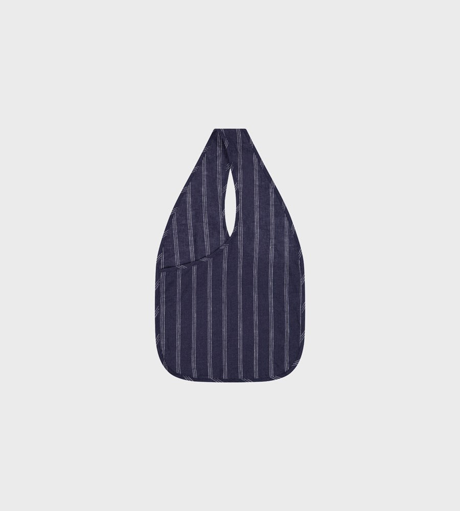 Navy striped bag on a light gray background
