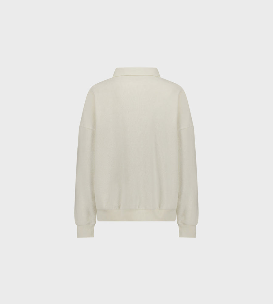 Beige sweater on a light grey background