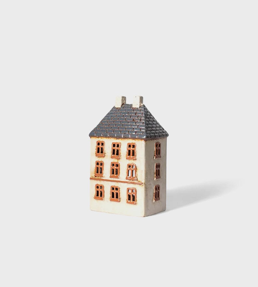 Small model of a house on a white background