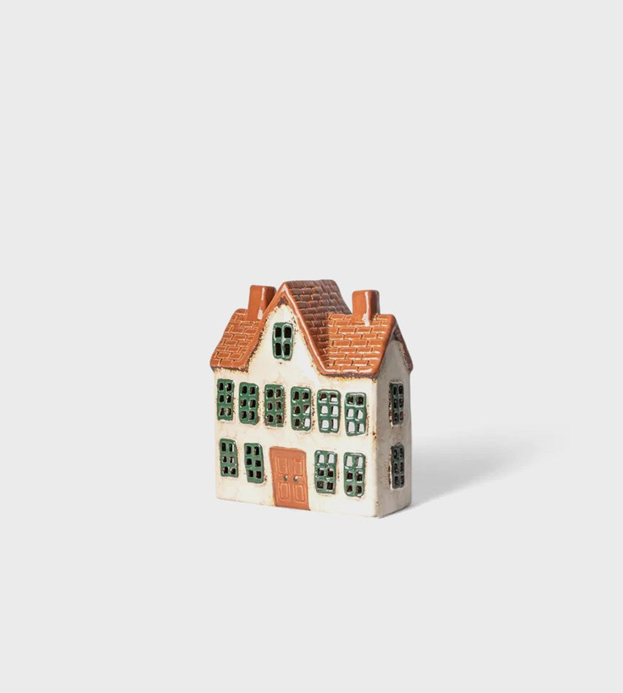 Small model of a house with a brown roof on a white background