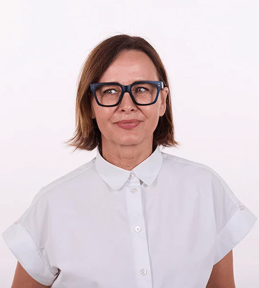 Person wearing a white shirt and blue glasses on a white background
