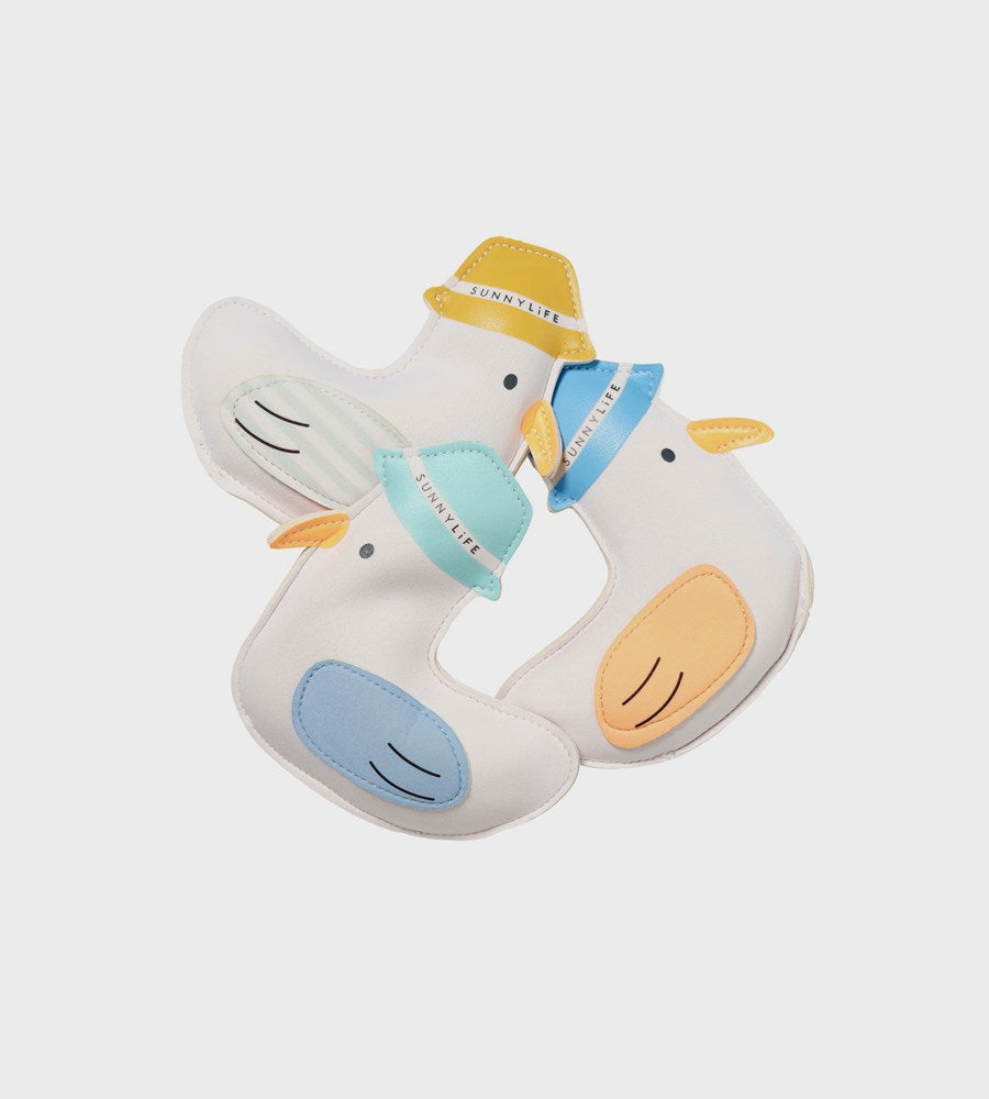 Two cartoon-style ducks with hats on a light gray background