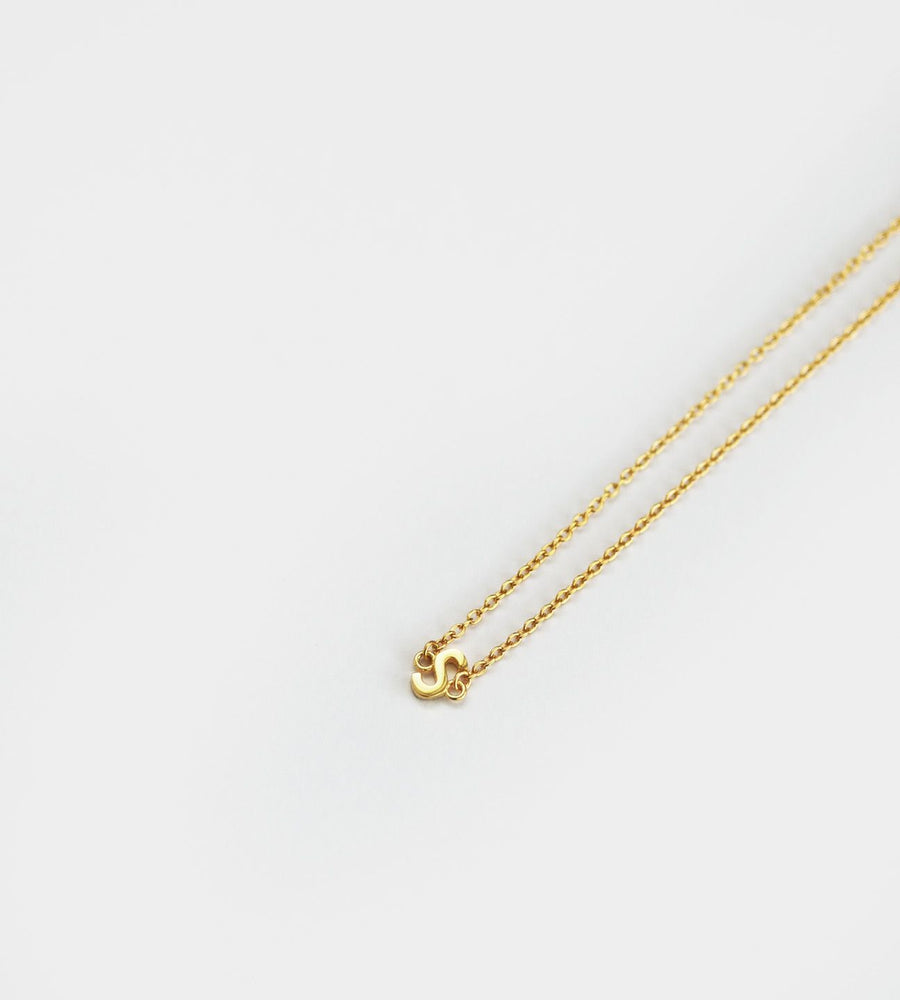 Gold necklace on a white background