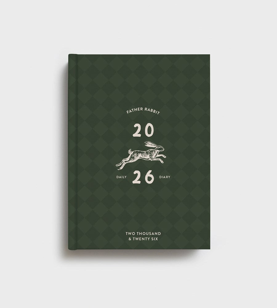 Green diary with rabbit illustration and text on a white background