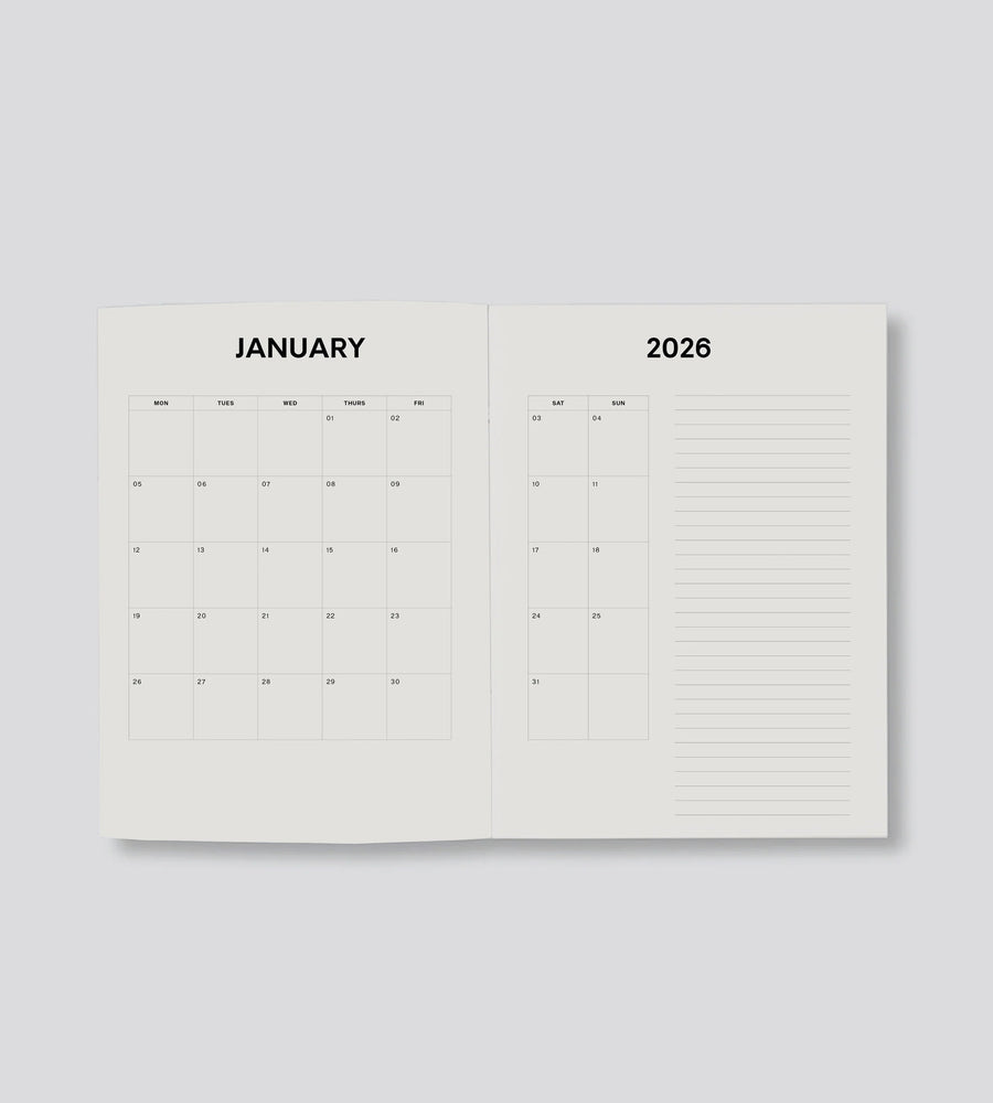 Open planner showing January 2026 on a light gray background
