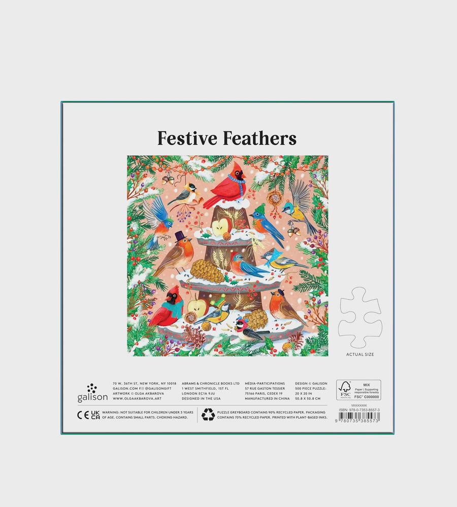 Festive Feathers puzzle packaging with birds and a cake design on a white background