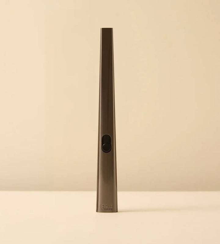 Tall, thin metallic object on a beige background