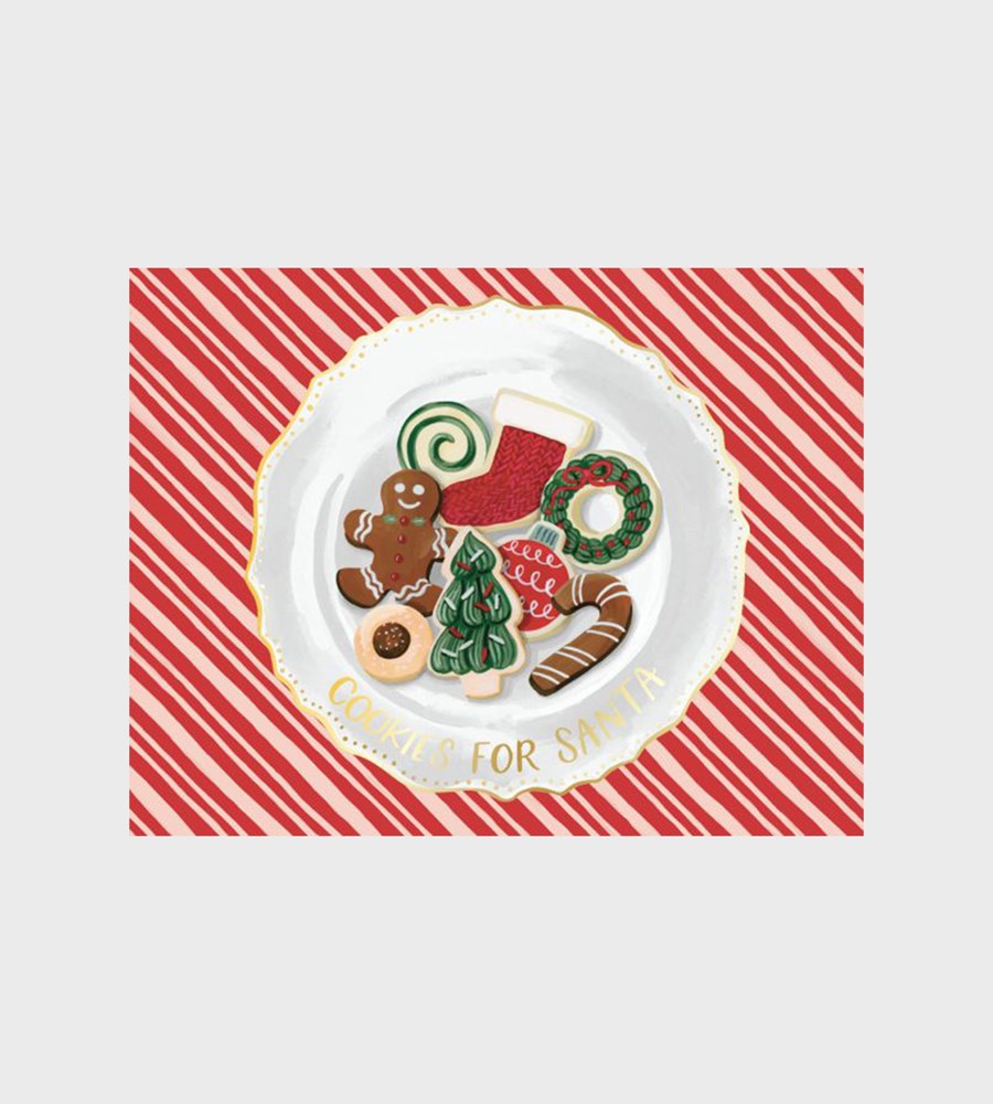Decorative plate with Christmas-themed cookies on a red and white striped background