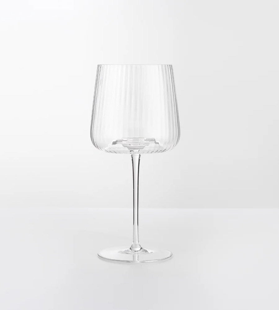 Clear wine glass on a white background