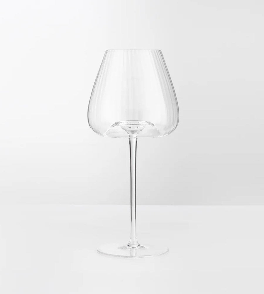 Clear wine glass on a white background