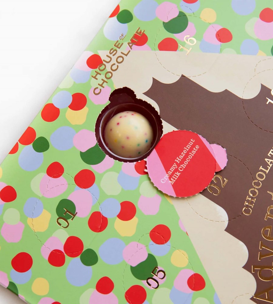 Chocolate bar with a colorful packaging featuring a candy and a tag.