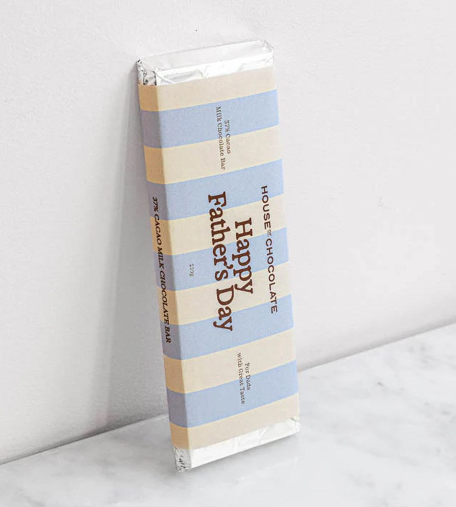 Chocolate bar with 'Happy Father's Day' packaging on a white surface