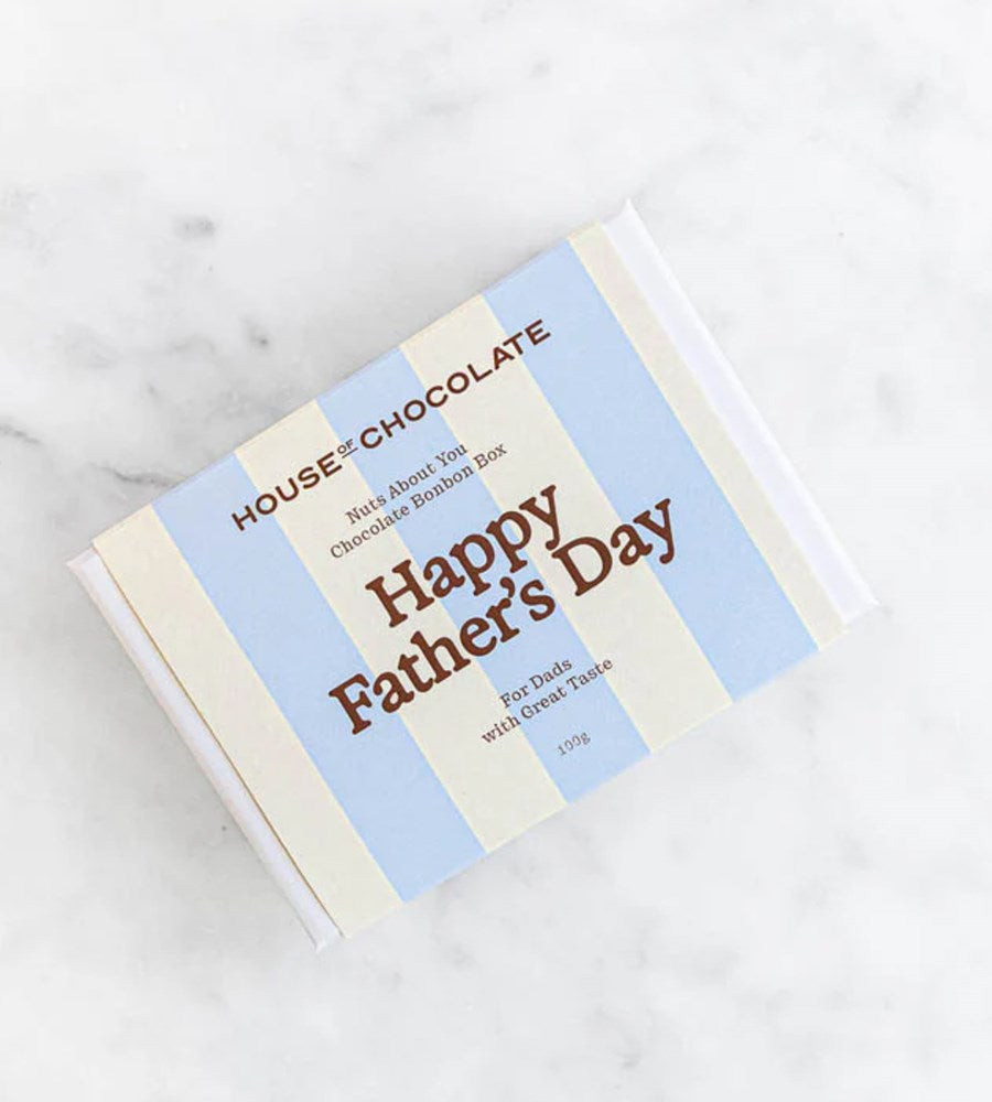 Chocolate box with 'Happy Father's Day' text on a marble surface