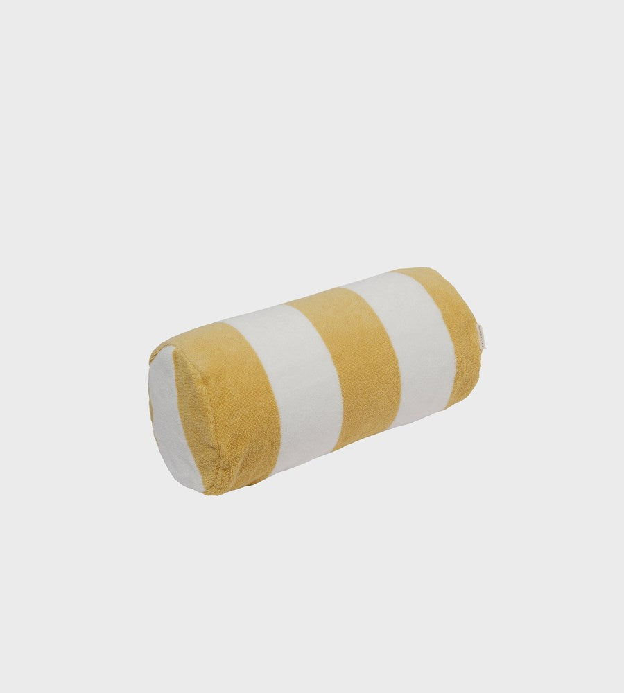 Round cylindrical pillow with yellow and white stripes on a light gray background