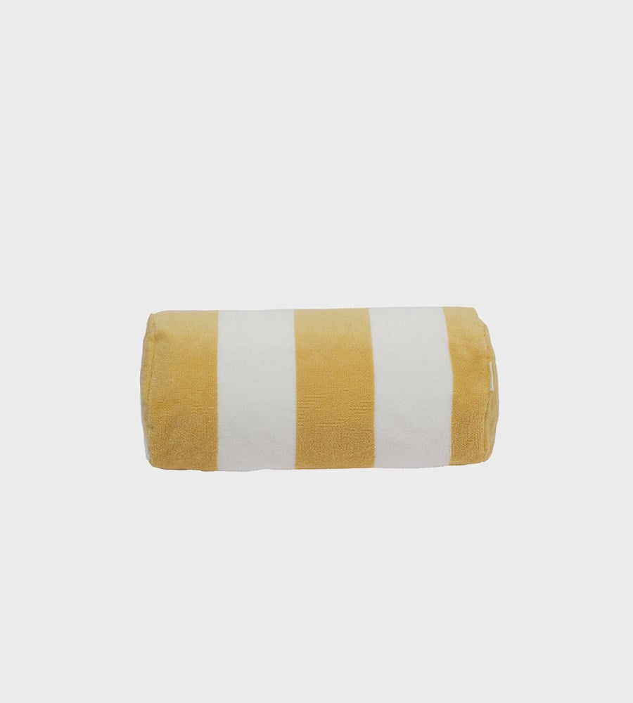 Rolled-up towel with yellow and white stripes on a light gray background
