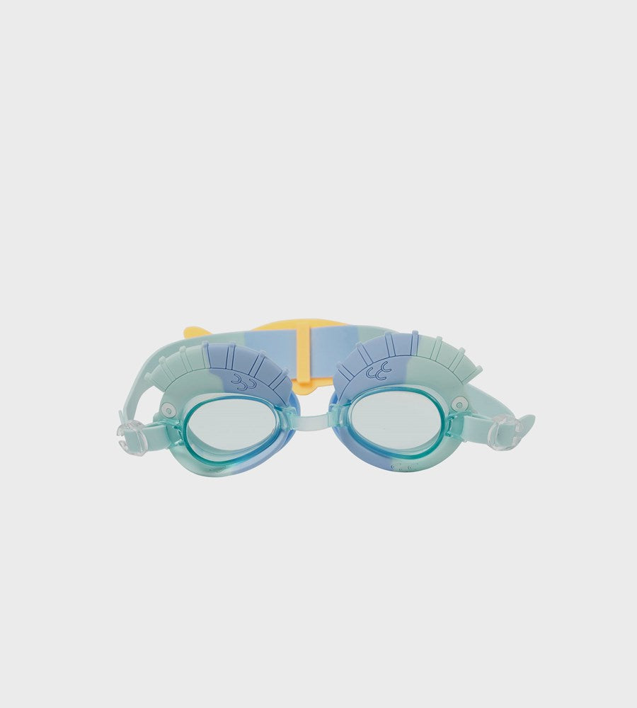 Colorful swim goggles on a light gray background