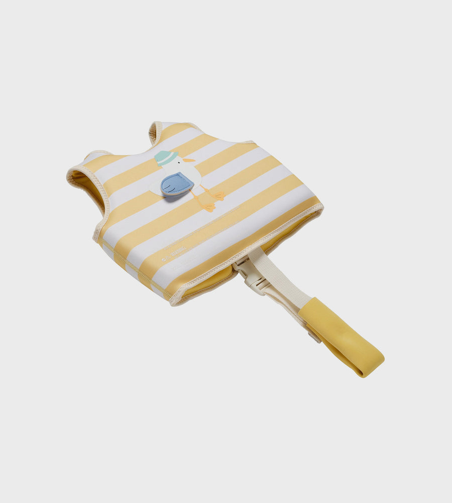 Yellow and white striped pet life jacket on a light gray background