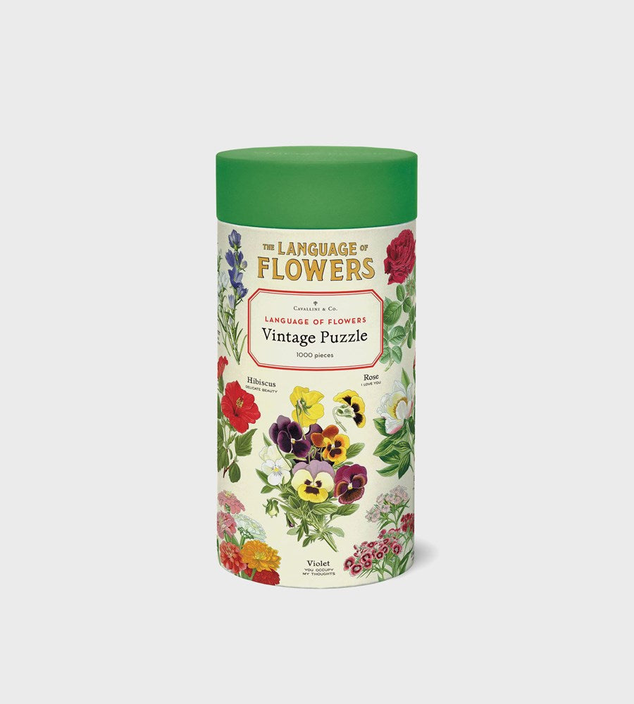  cylindrical product packaging with floral design and text on a white background