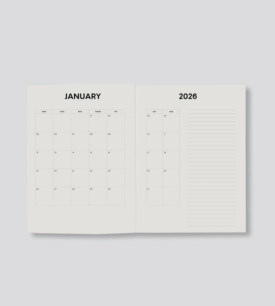 Open planner showing January 2026 on a light gray background