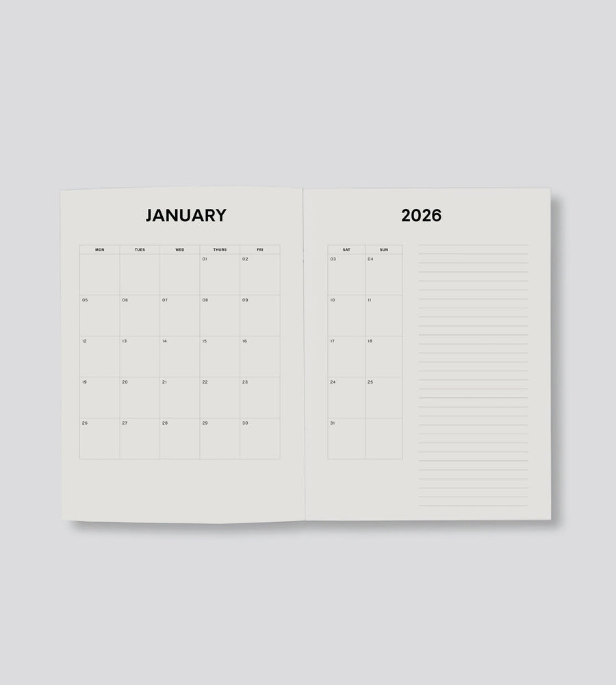Open planner showing January 2026 on a light gray background