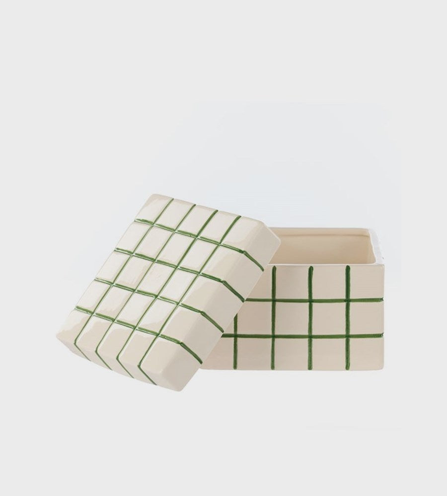 Rectangular box with a green grid pattern on a light gray background