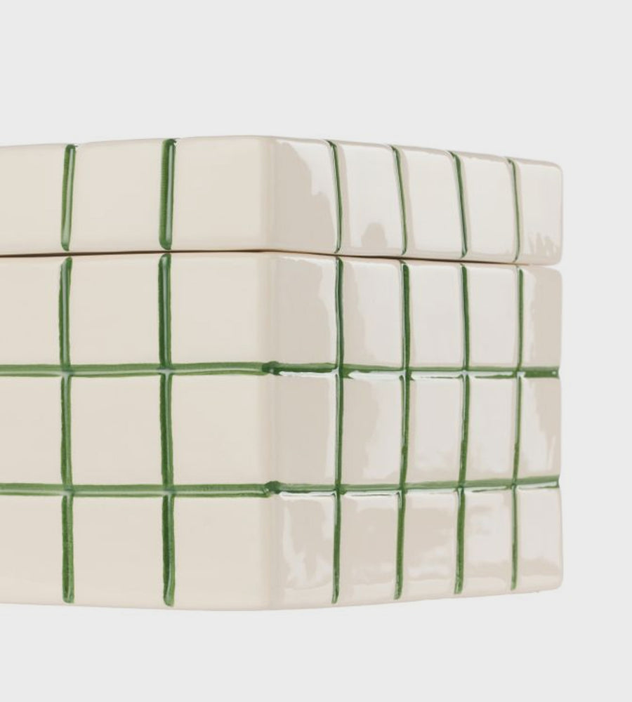 Rectangular ceramic container with green grid pattern on a white background
