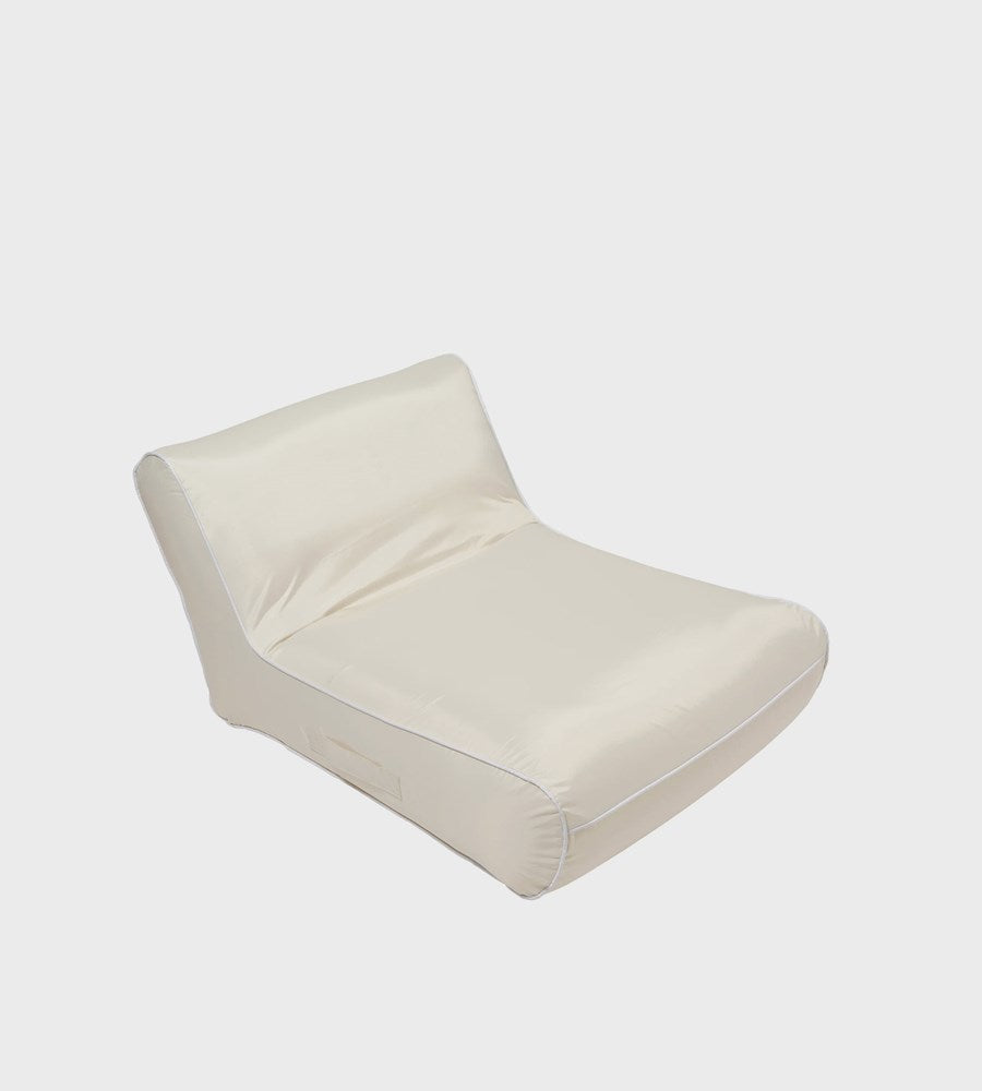 Beige lounge chair on a white background