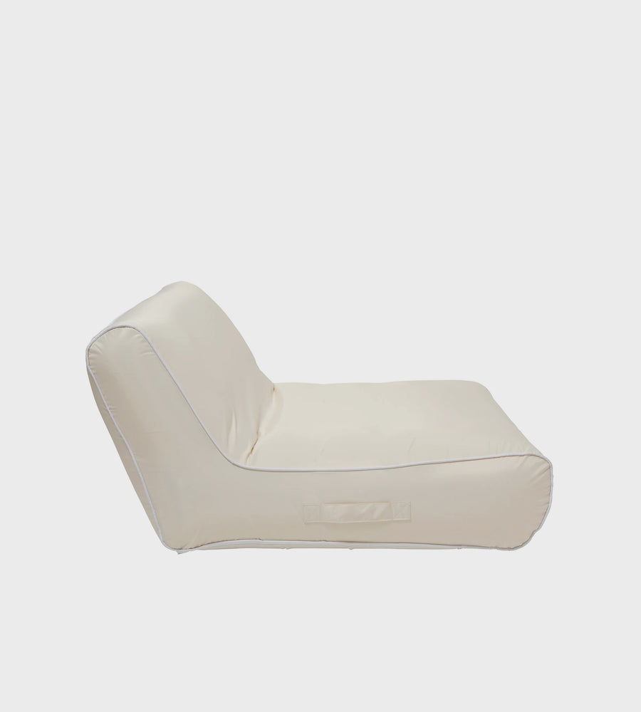 Beige inflatable lounge chair on a white background