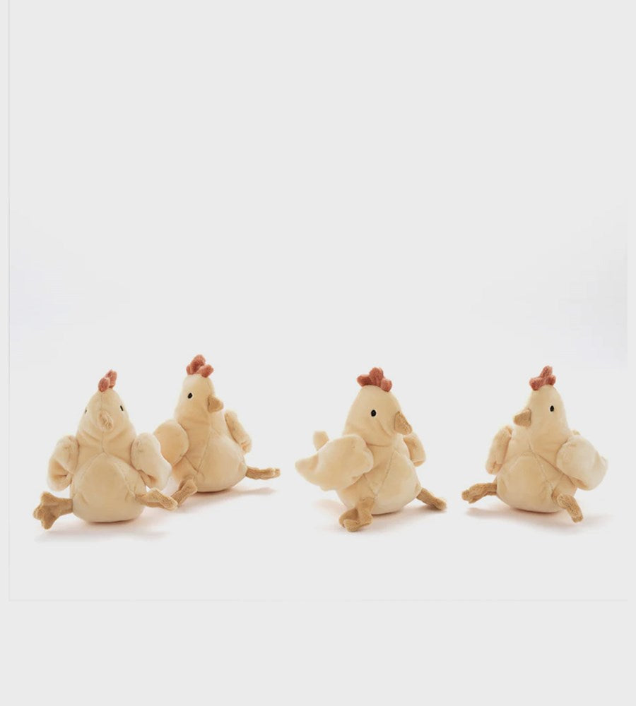 Four plush chicken toys on a white background