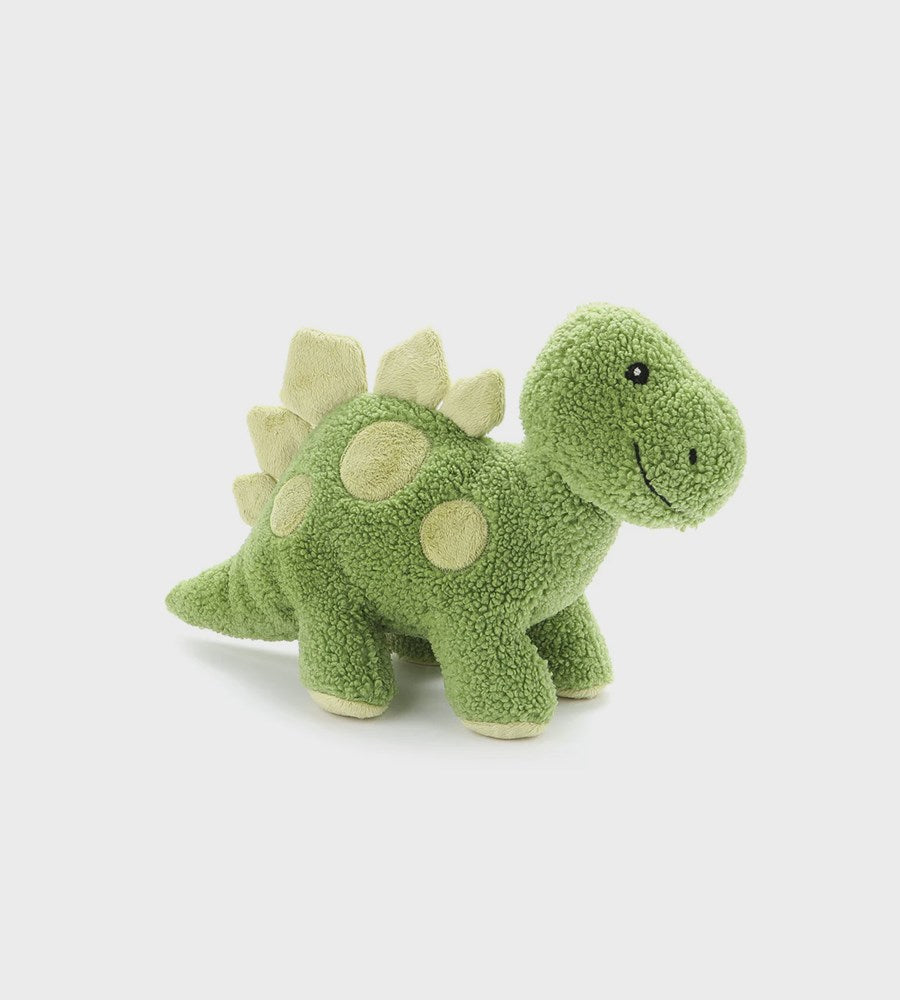 Green plush dinosaur toy on a light gray background
