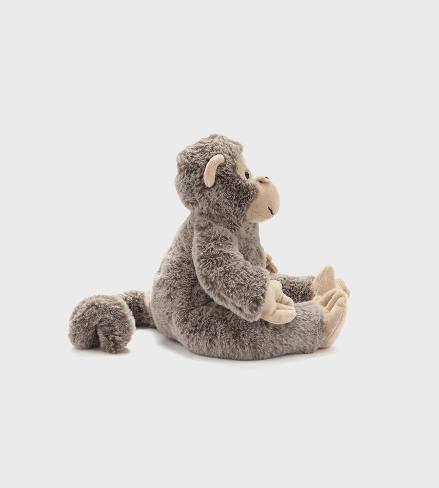 Plush monkey toy on a light gray background