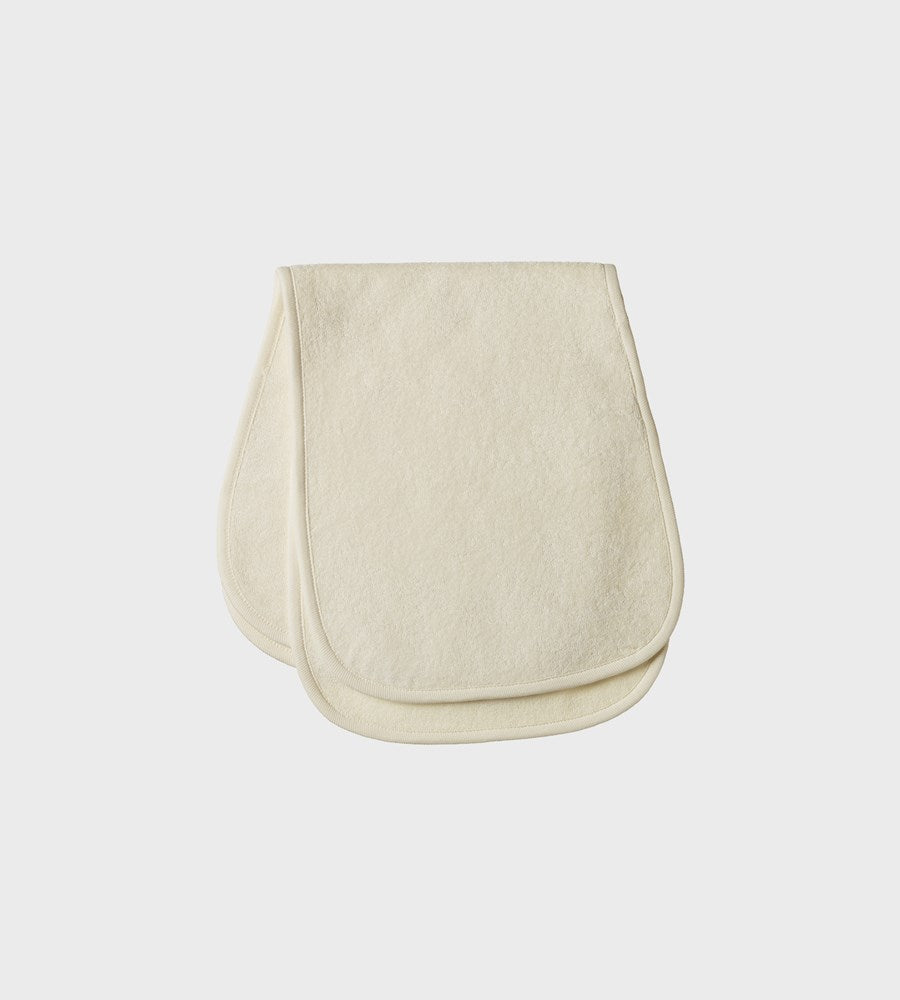 Beige baby bib on a white background