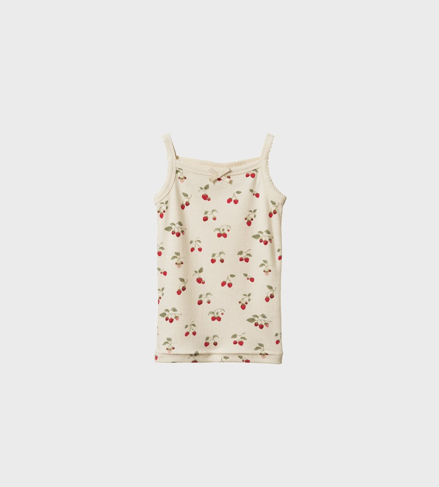 White tank top with cherry pattern on a light gray background