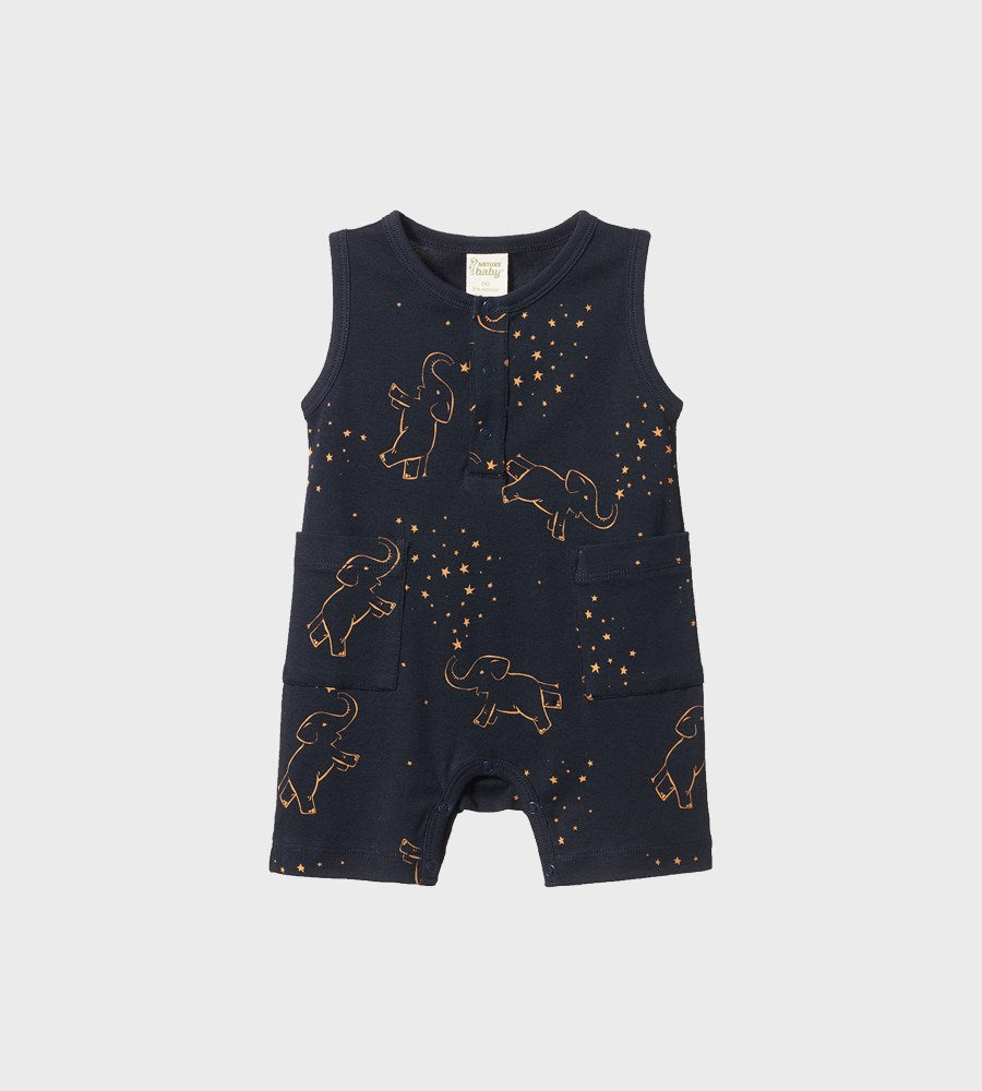 Navy blue romper with elephant pattern on a light gray background