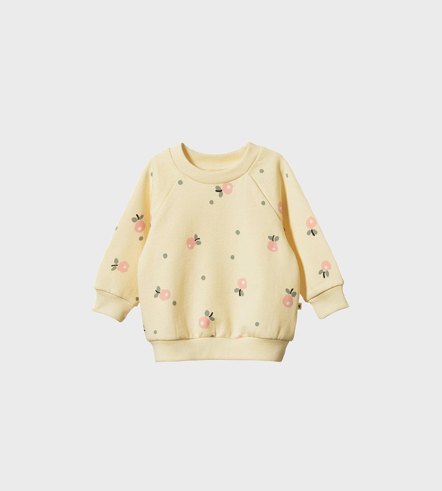 Yellow sweatshirt with floral embroidery on a white background