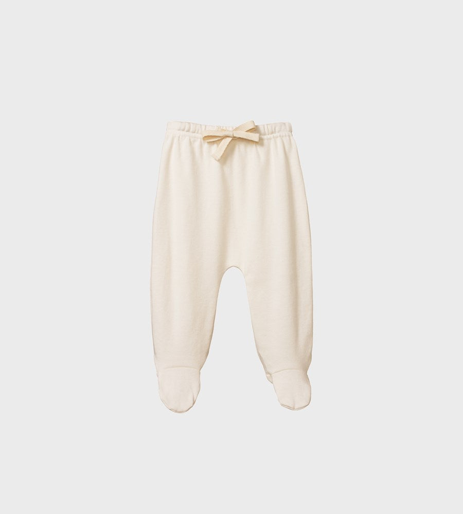 Beige baby pants with footies on a light gray background